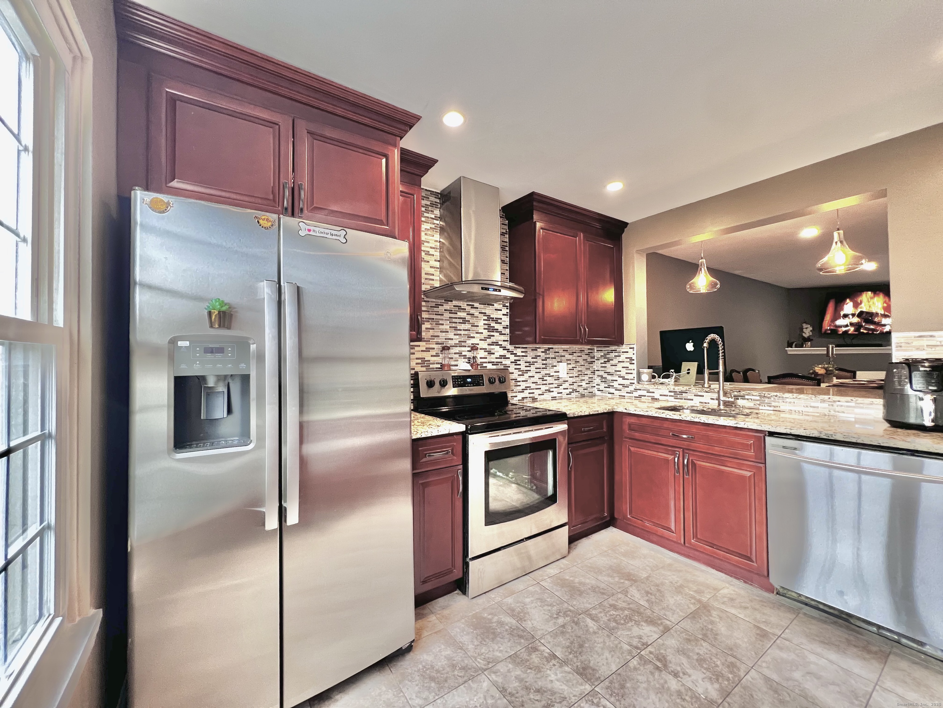 782 Oronoke Road, Unit 27 Waterbury, CT 06708 - Photo 7 of 28 a kitchen with stainless steel appliances granite countertop a refrigerator and a sink