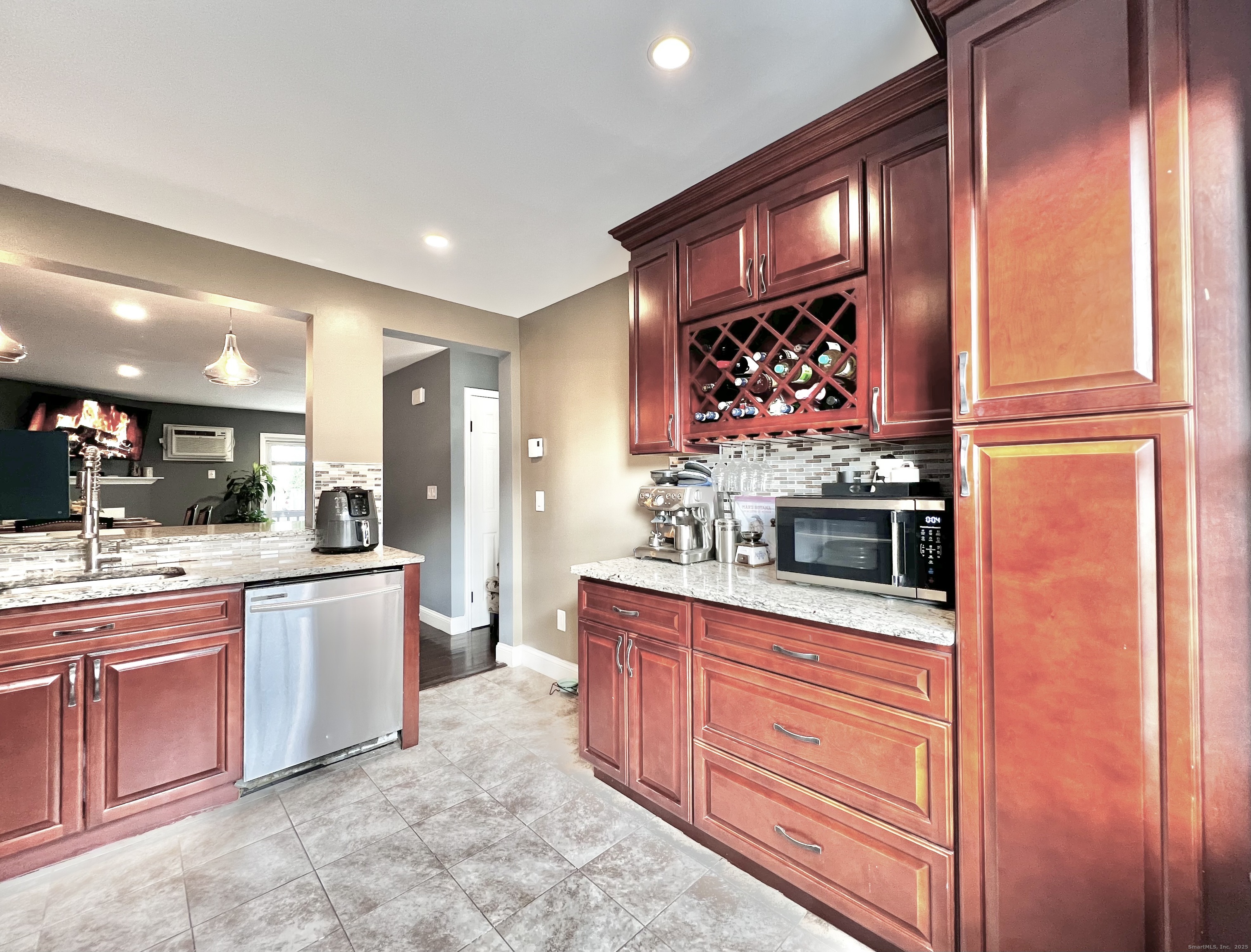782 Oronoke Road, Unit 27 Waterbury, CT 06708 - Photo 9 of 28 a kitchen with stainless steel appliances granite countertop a stove and a sink