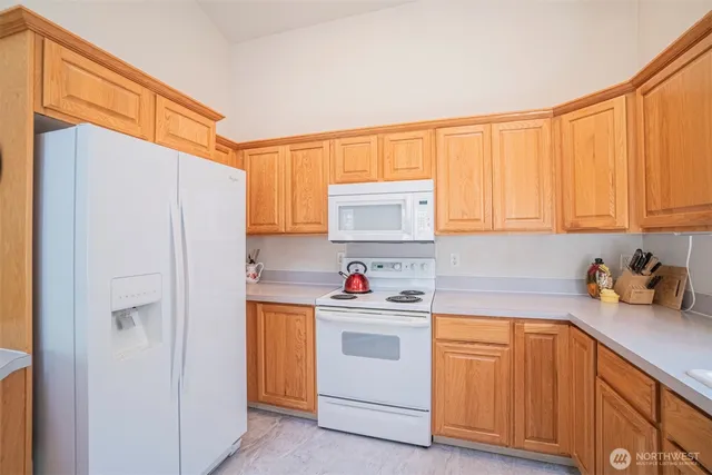 a kitchen with a sink cabinets and window