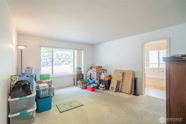 a bed room with furniture and a window