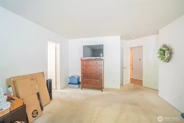a view of room with wooden floor and closet