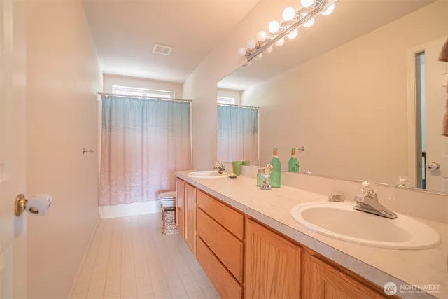 a bathroom with a sink a vanity and a mirror
