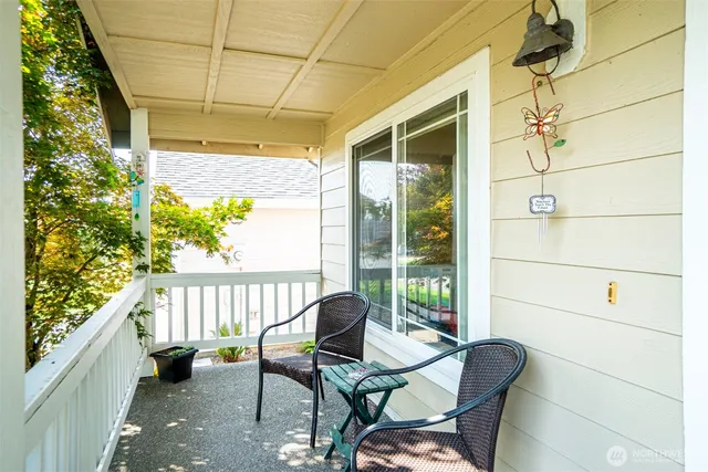 a view of a balcony with chairs