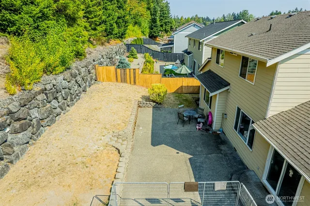 a view of a backyard with sitting area