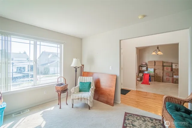 a living room with furniture and a large window