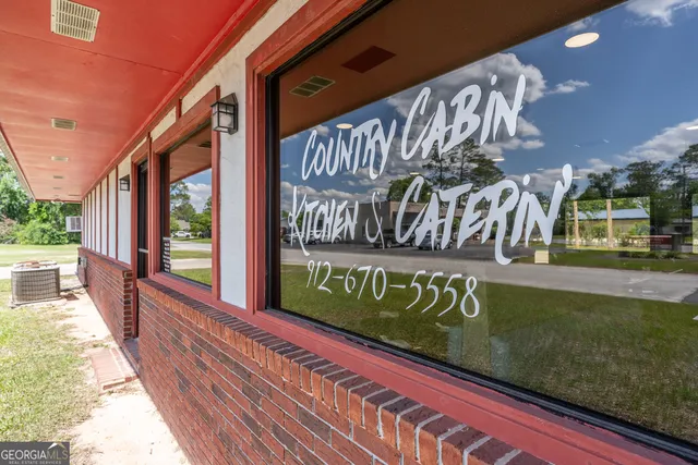 a view of a street with an outdoor seating