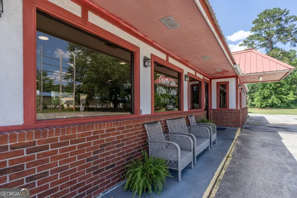 a view of swimming pool with outdoor seating
