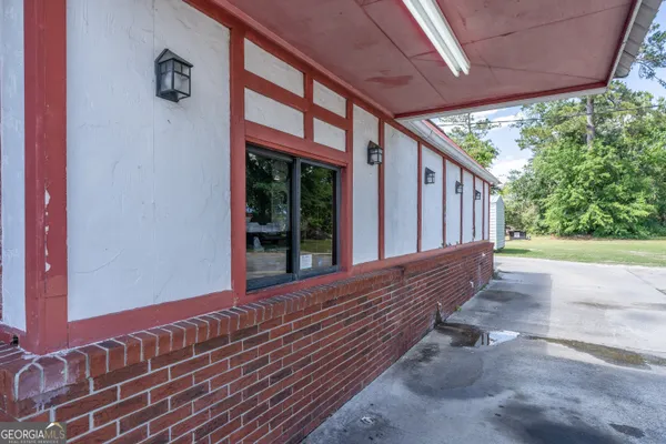 a view of balcony with wooden floor