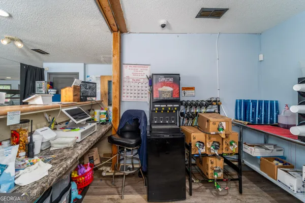 a utility room with lots of furniture and toys