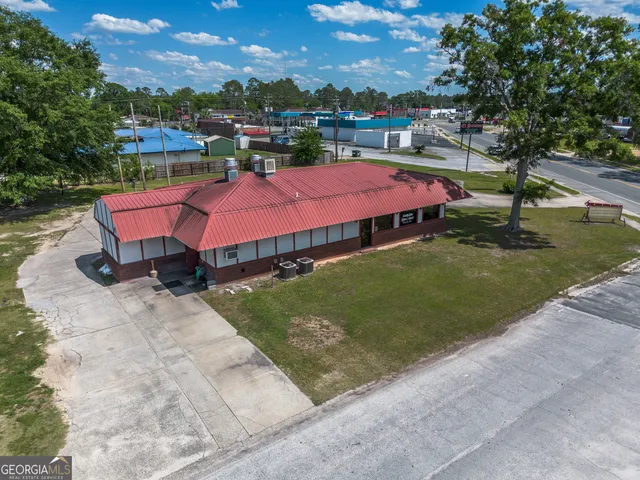 an outdoor space with pool and trees