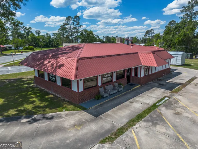 a view of a yard with an outdoor seating