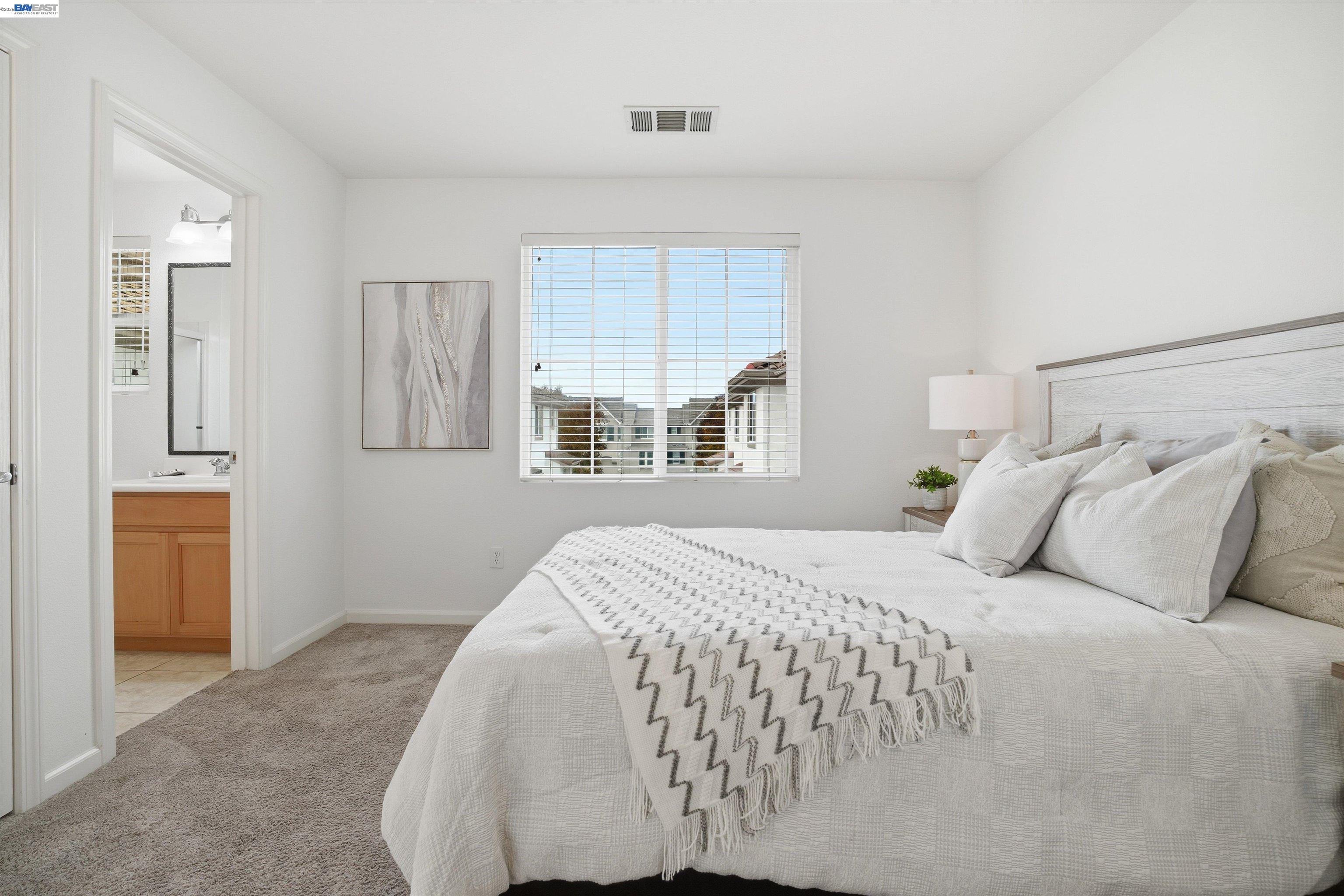 2833 Alnwick Avenue, Unit 7 Livermore, CA 94551 - Photo 25 of 37 a bedroom with a bed and a window