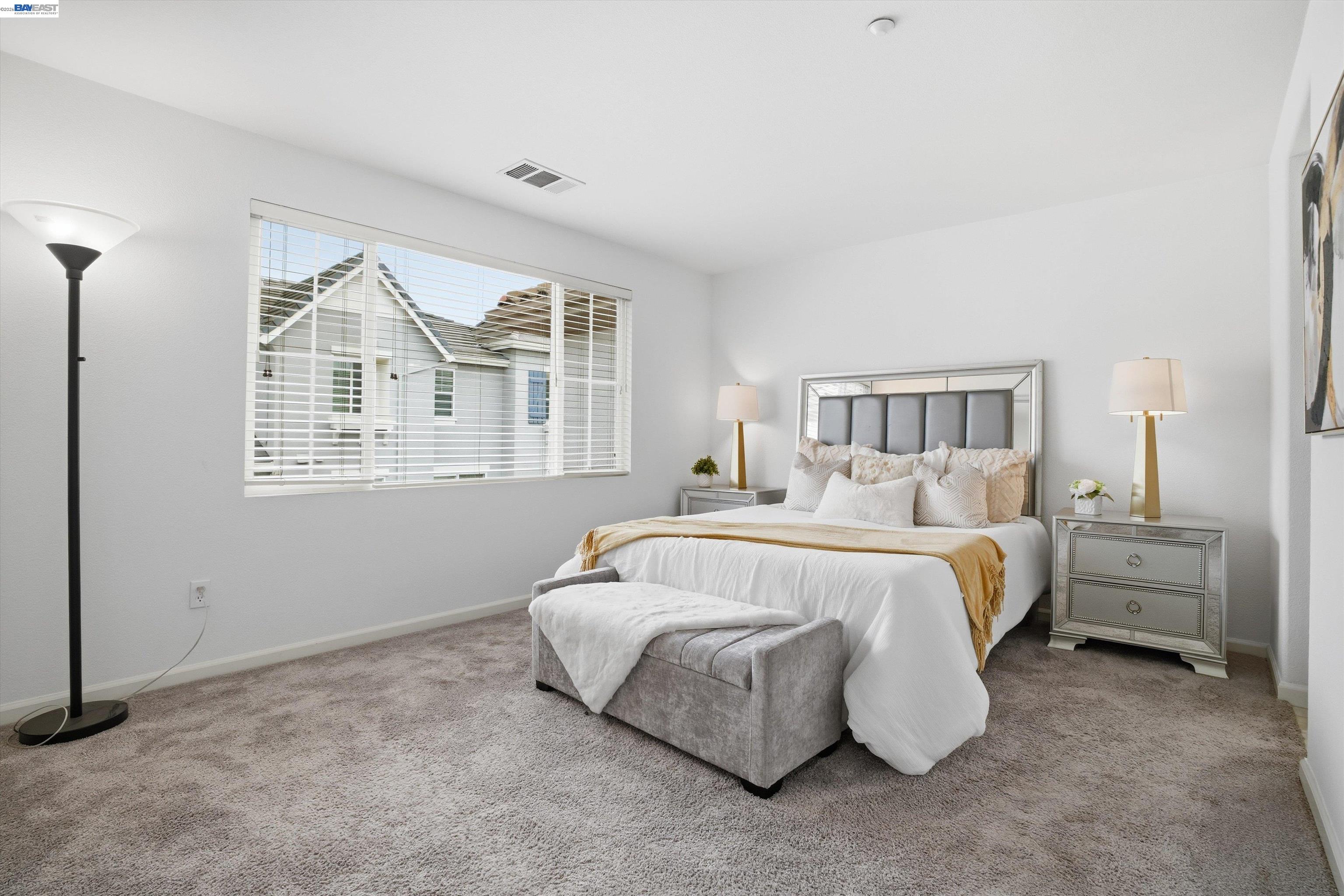 2833 Alnwick Avenue, Unit 7 Livermore, CA 94551 - Photo 27 of 37 a spacious bedroom with a bed and a large window