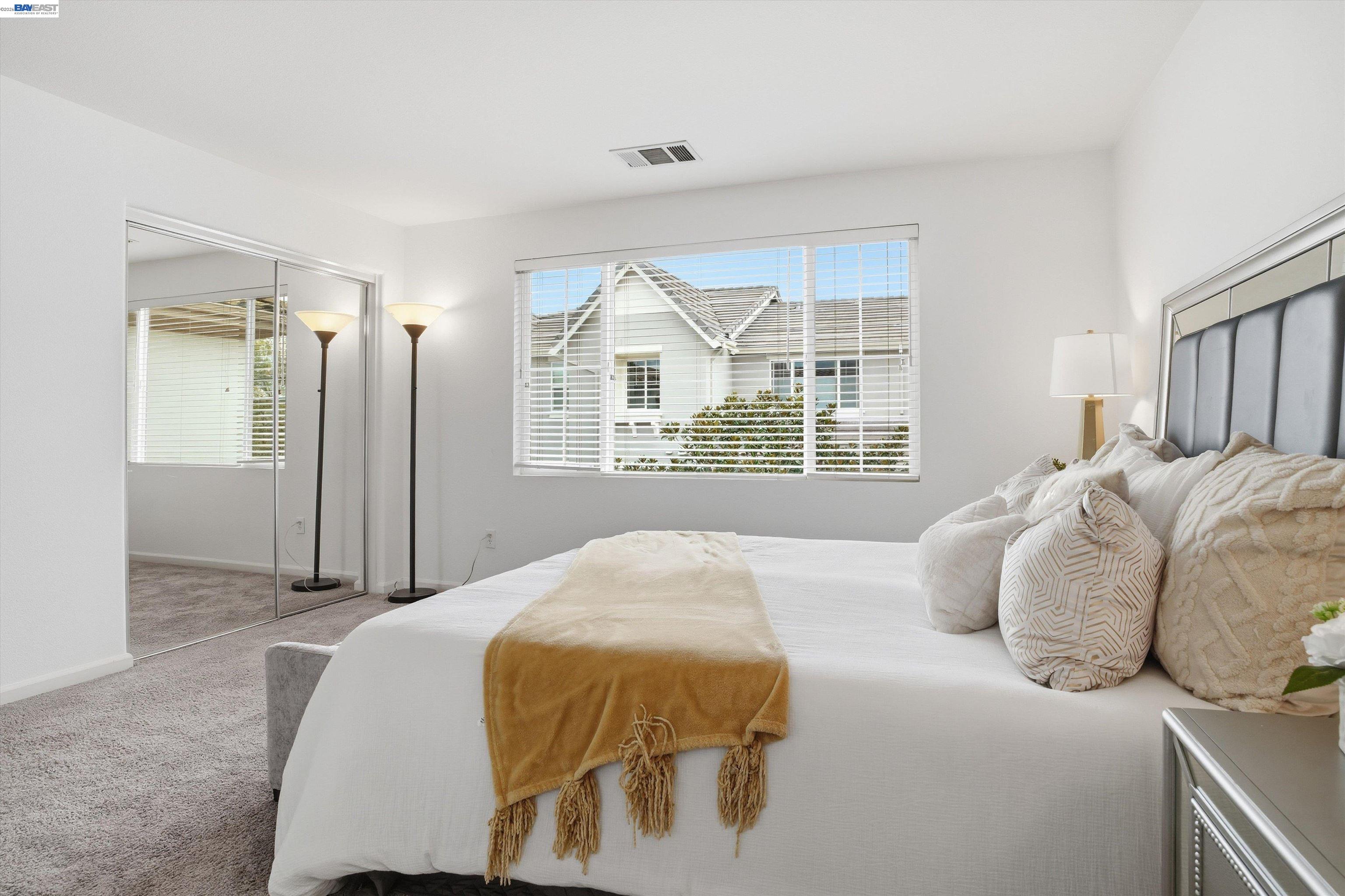 2833 Alnwick Avenue, Unit 7 Livermore, CA 94551 - Photo 28 of 37 a bedroom with a bed and a window