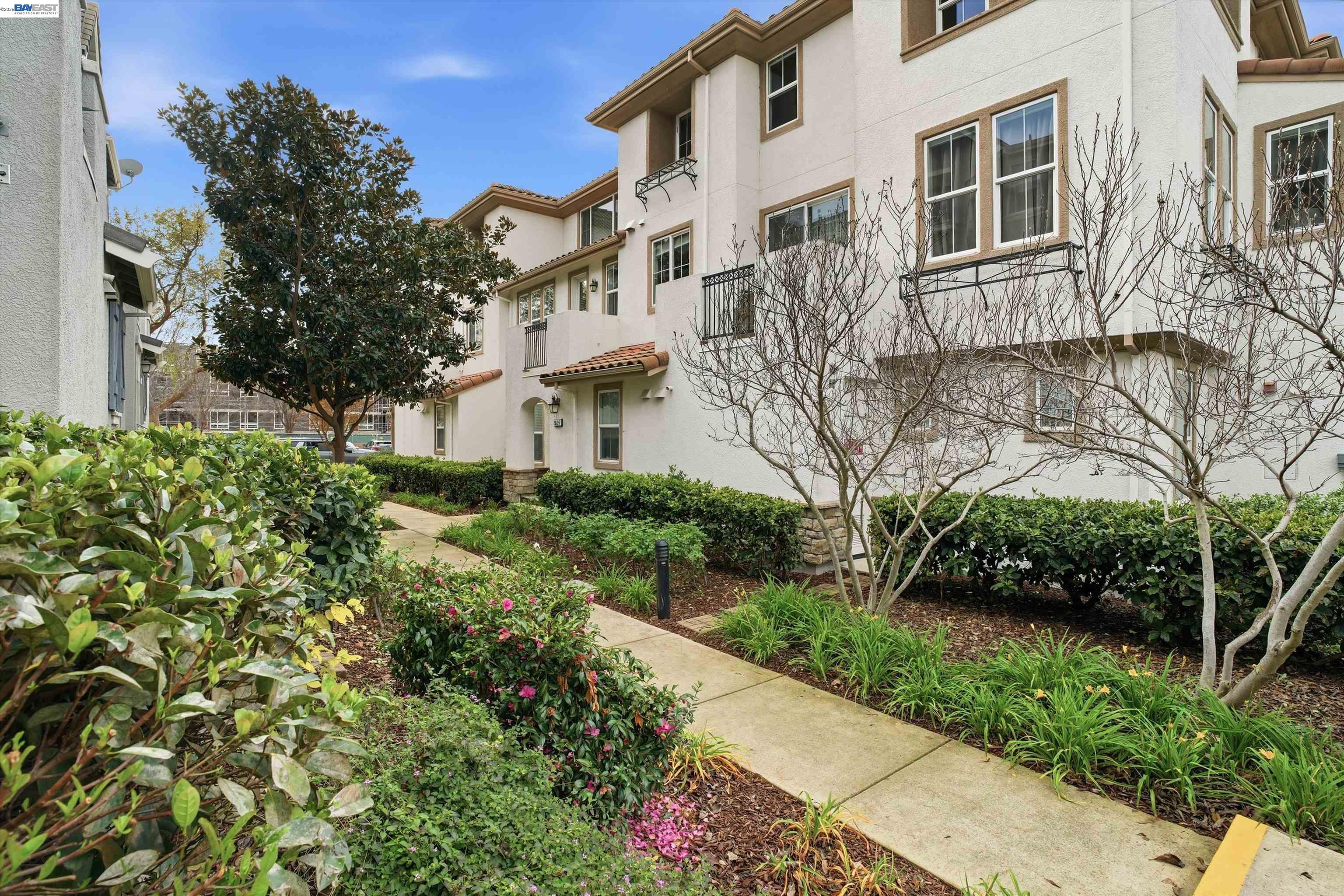 2833 Alnwick Avenue, Unit 7 Livermore, CA 94551 - Photo 3 of 37 a view of a building with a yard
