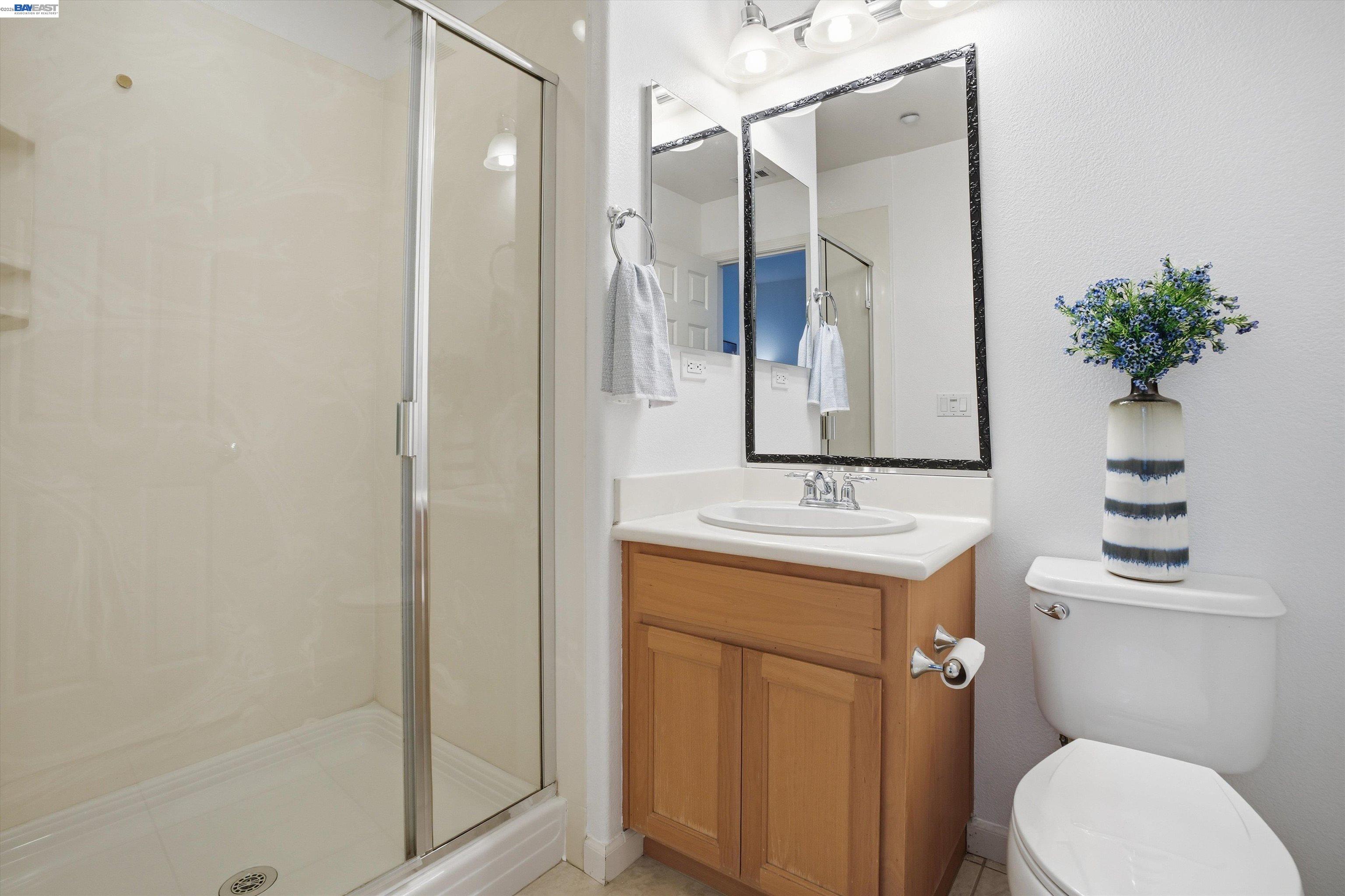2833 Alnwick Avenue, Unit 7 Livermore, CA 94551 - Photo 7 of 37 a bathroom with a sink a toilet and shower