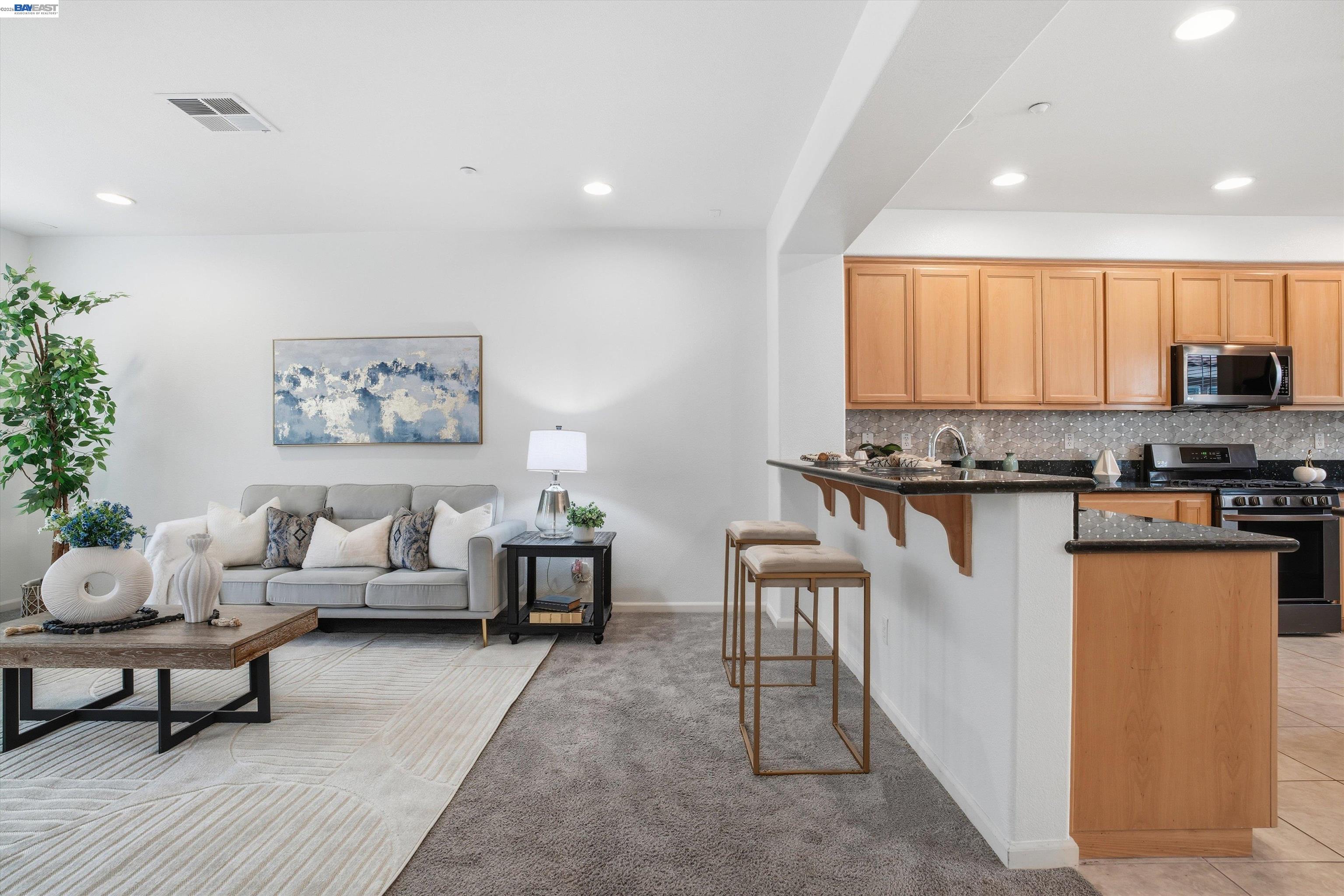 2833 Alnwick Avenue, Unit 7 Livermore, CA 94551 - Photo 8 of 37 a living room with furniture and a kitchen view