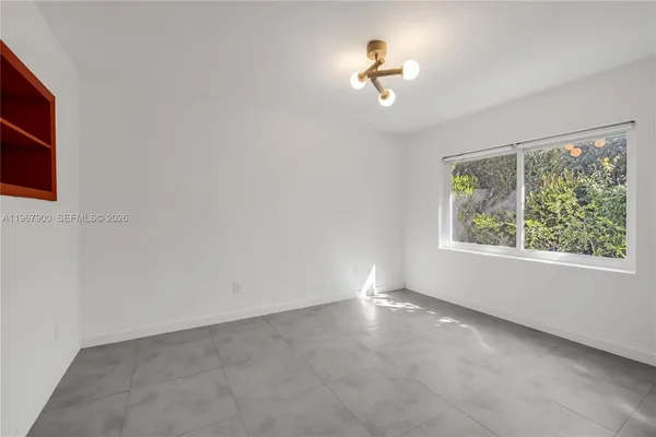 an empty room with windows