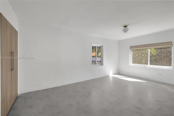 an empty room with windows