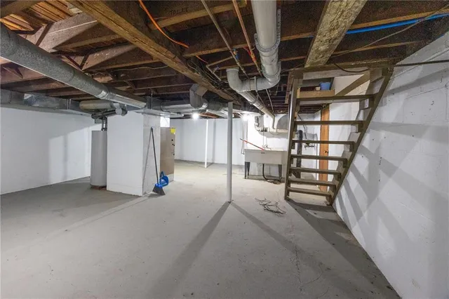 a view of empty room with wooden walls