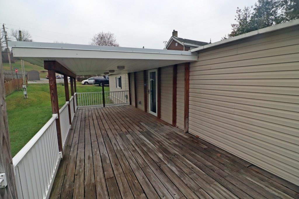 253 Wardentown Road Alverton, PA 15612 - Photo 13 of 18 a view of a house with a deck