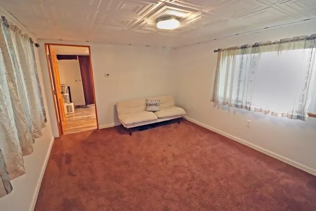 a view of room with window and hardwood floor