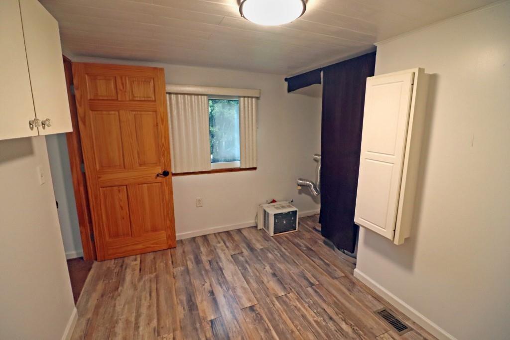 253 Wardentown Road Alverton, PA 15612 - Photo 7 of 18 a view of a room with wooden floor and a window