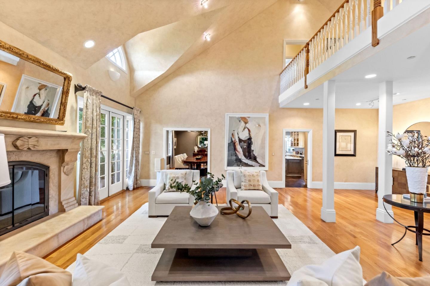 1600 Marlborough Road Hillsborough, CA 94010 - Photo 32 of 111 a living room with furniture a fireplace and a table