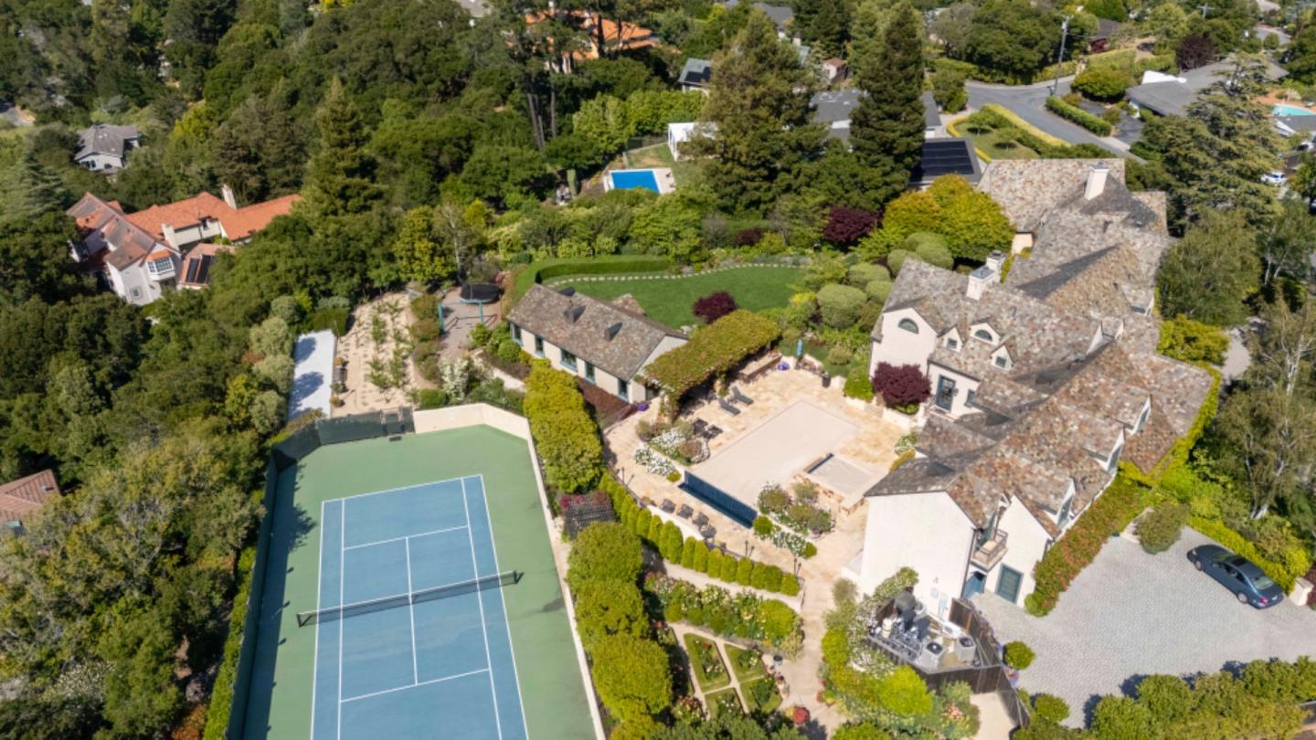 1600 Marlborough Road Hillsborough, CA 94010 - Photo 7 of 111 an aerial view of a residential apartment building with a yard and parking spaces