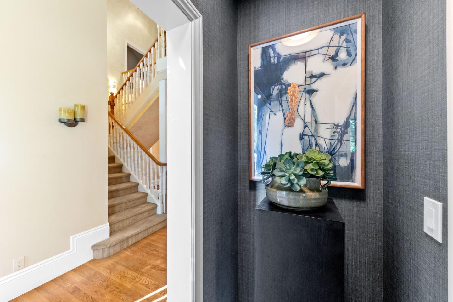 1600 Marlborough Road Hillsborough, CA 94010 - Photo 82 of 111 a view of a hallway with wooden floor and a potted plant