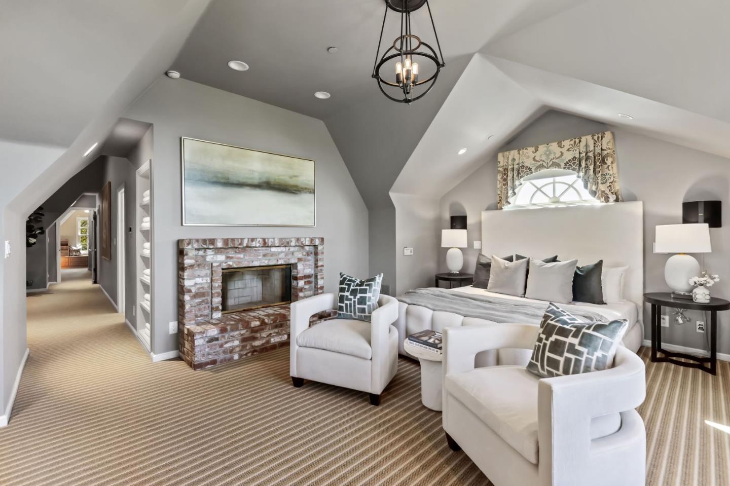 1600 Marlborough Road Hillsborough, CA 94010 - Photo 91 of 111 a living room with furniture a fireplace and a chandelier