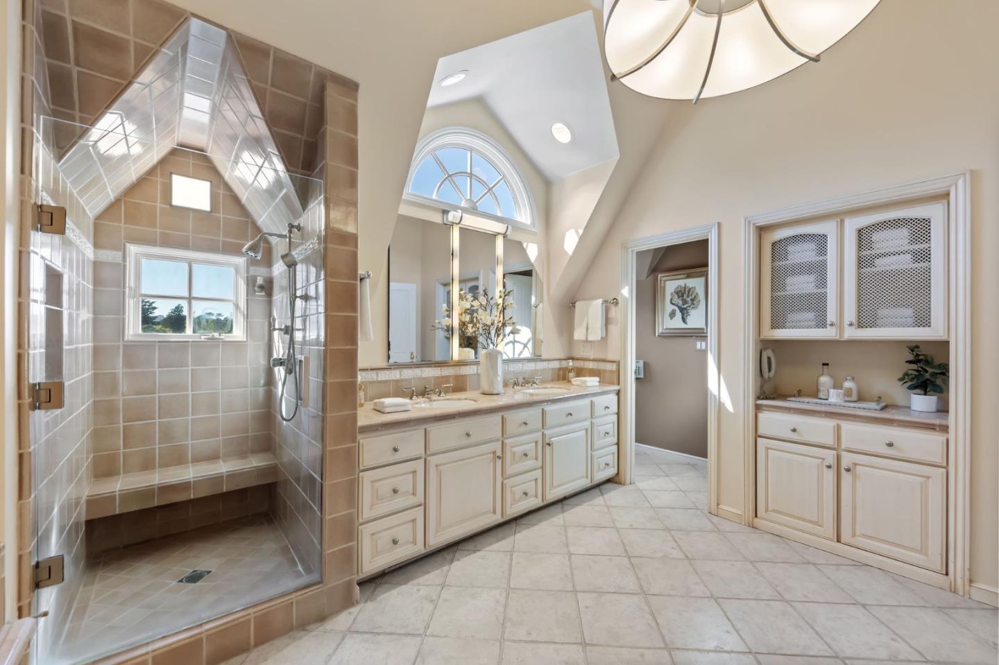 1600 Marlborough Road Hillsborough, CA 94010 - Photo 96 of 111 a spacious bathroom with a granite countertop sink a mirror and a shower
