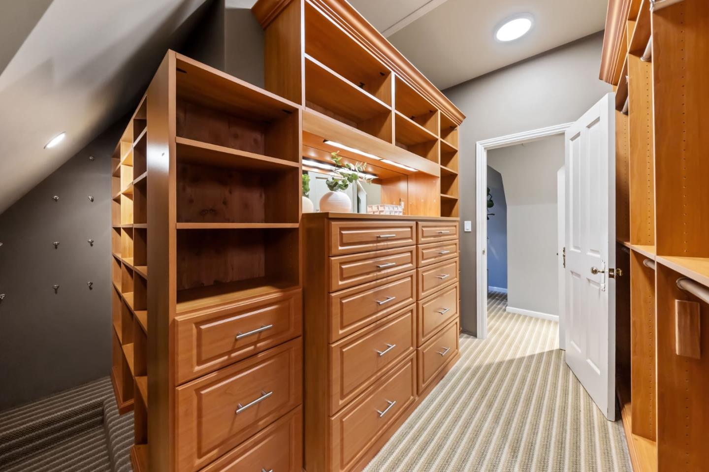 1600 Marlborough Road Hillsborough, CA 94010 - Photo 99 of 111 a view of walk in closet with wooden floor and chair
