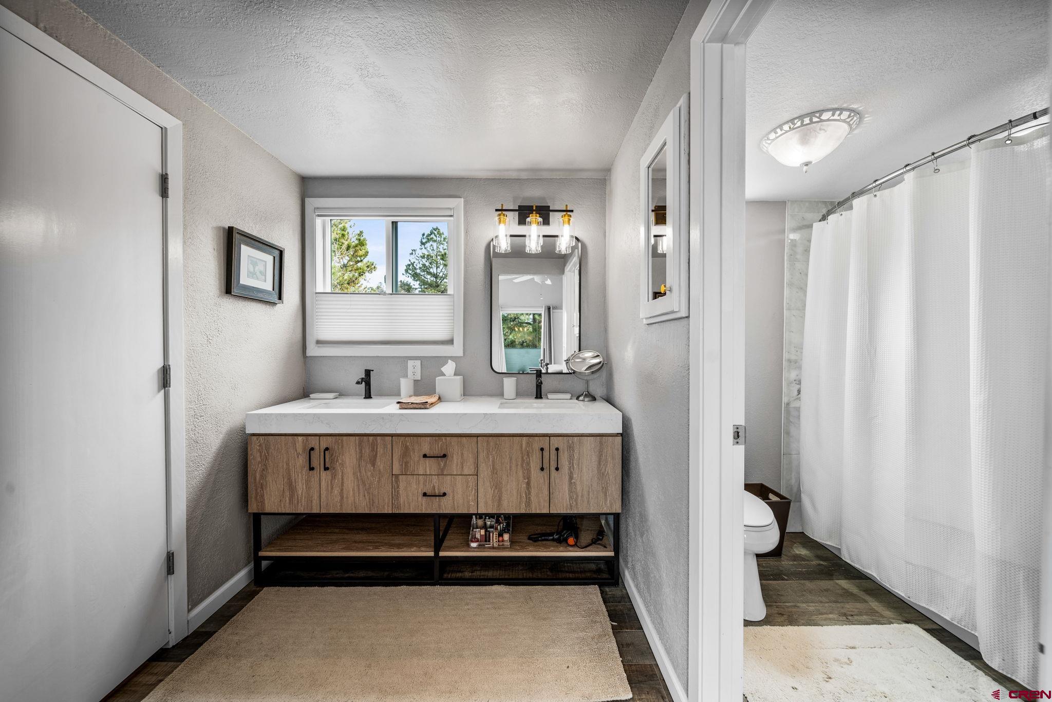 25 Highland Place Durango, CO 81301 - Photo 14 of 40 a spacious bathroom with a bathtub and shower