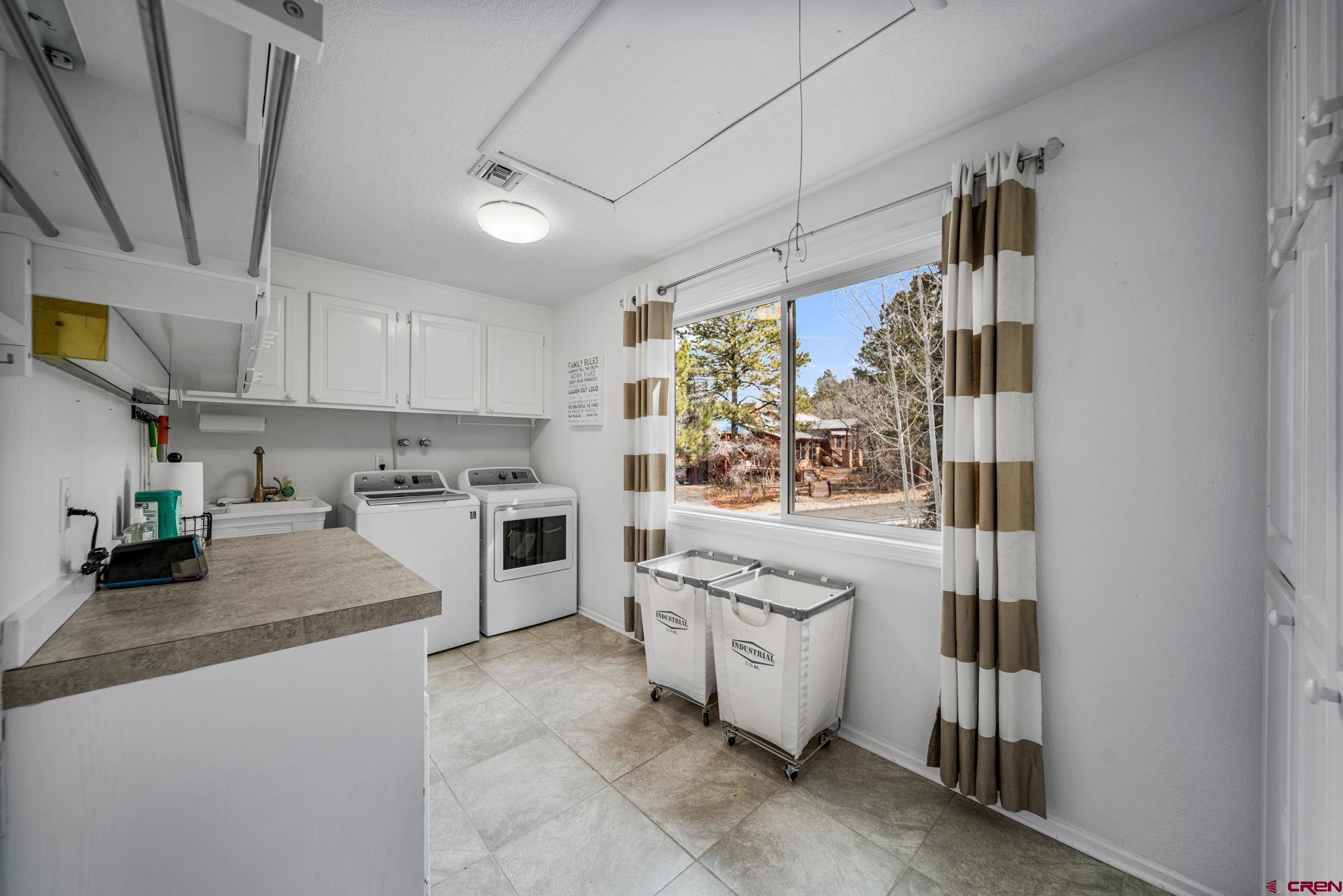 25 Highland Place Durango, CO 81301 - Photo 17 of 40 a kitchen with stainless steel appliances granite countertop a stove and a sink