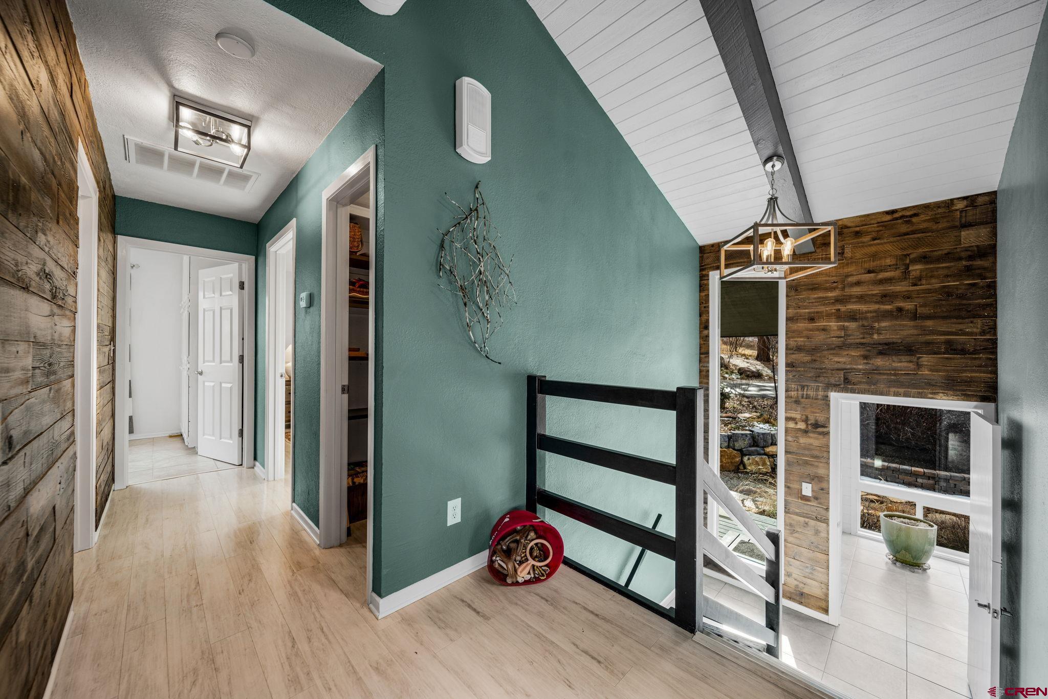25 Highland Place Durango, CO 81301 - Photo 18 of 40 a view of a hallway with wooden floor and staircase