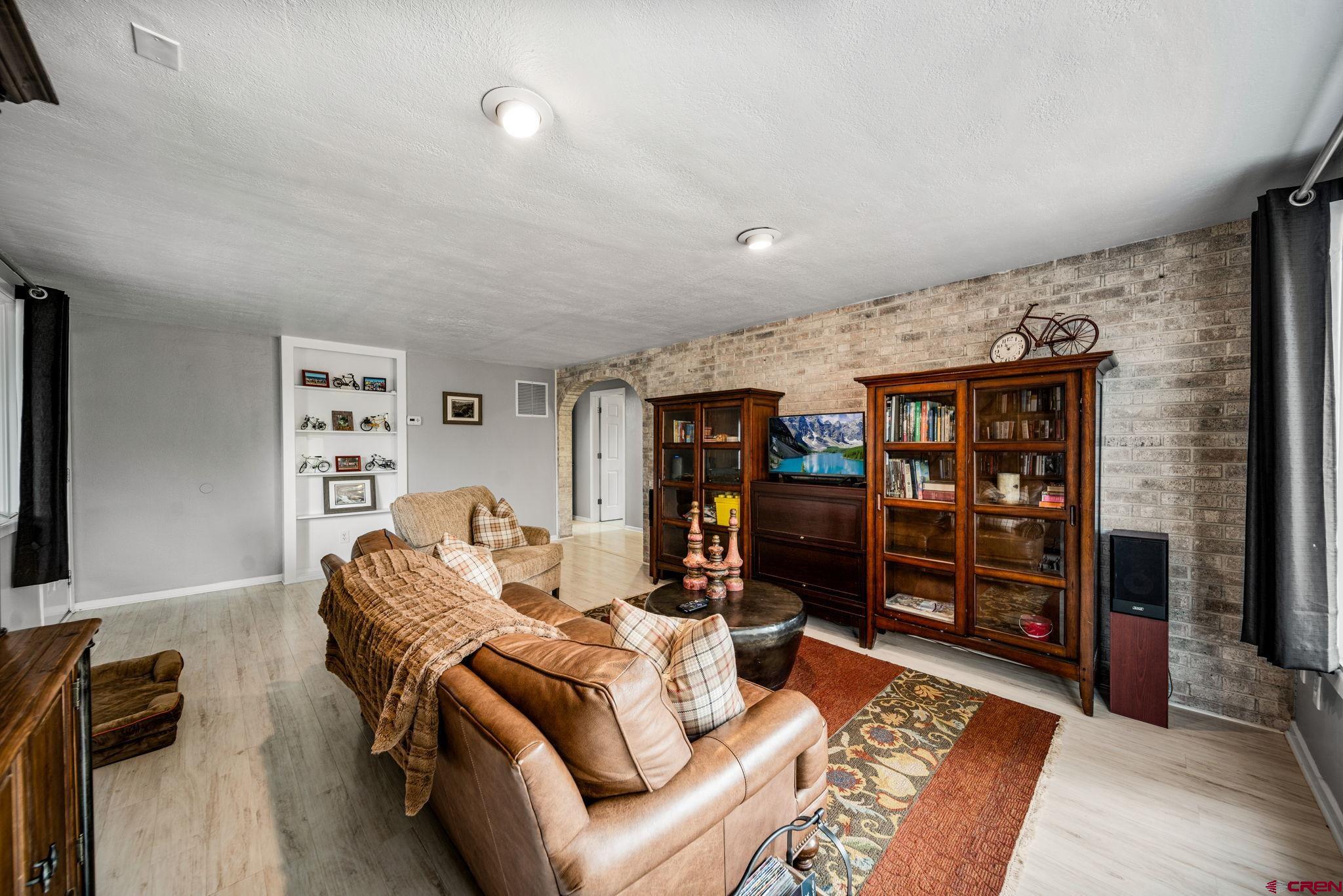 25 Highland Place Durango, CO 81301 - Photo 23 of 40 a living room with furniture a rug and a flat screen tv