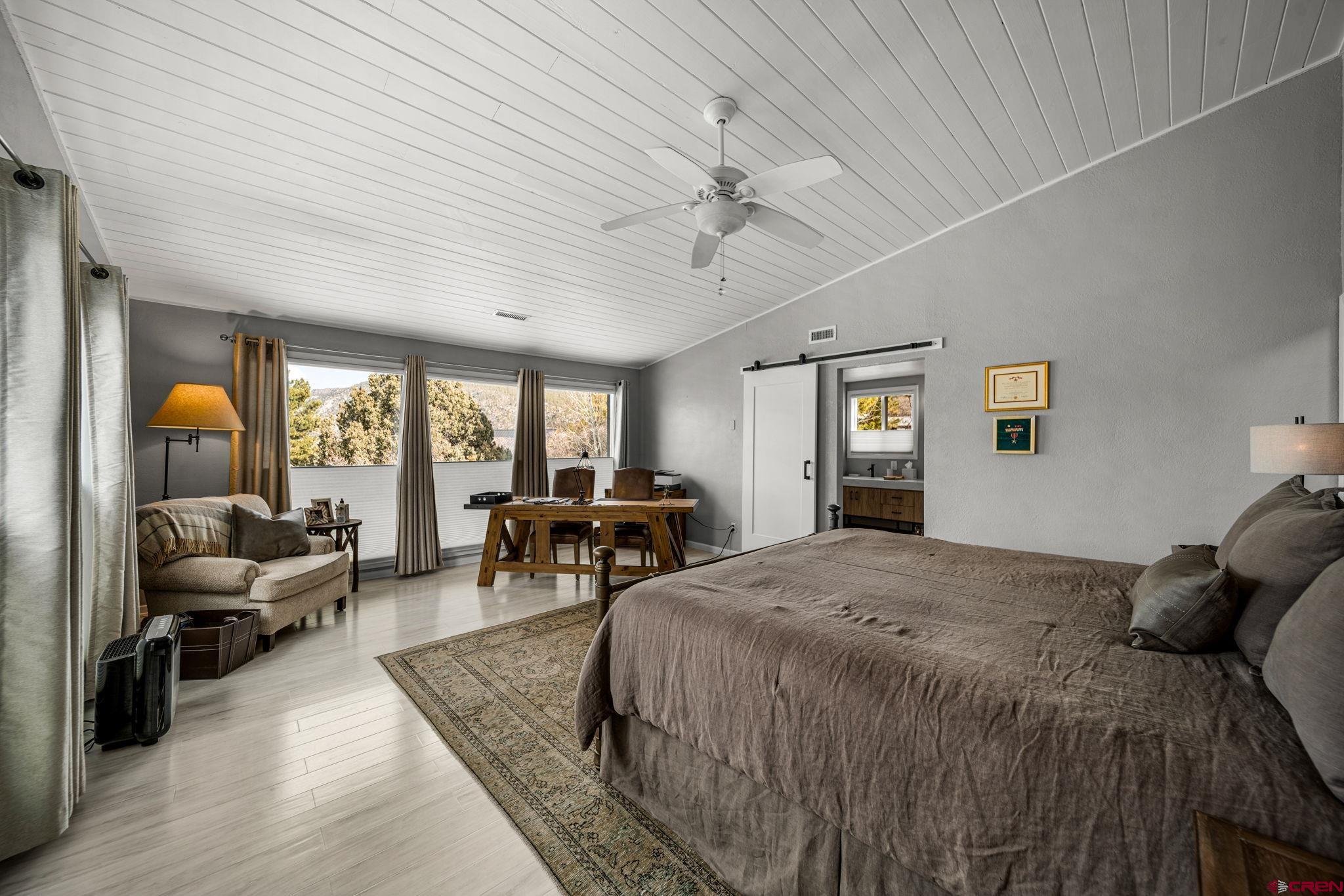 25 Highland Place Durango, CO 81301 - Photo 10 of 40 a bed room with a bed and a chair