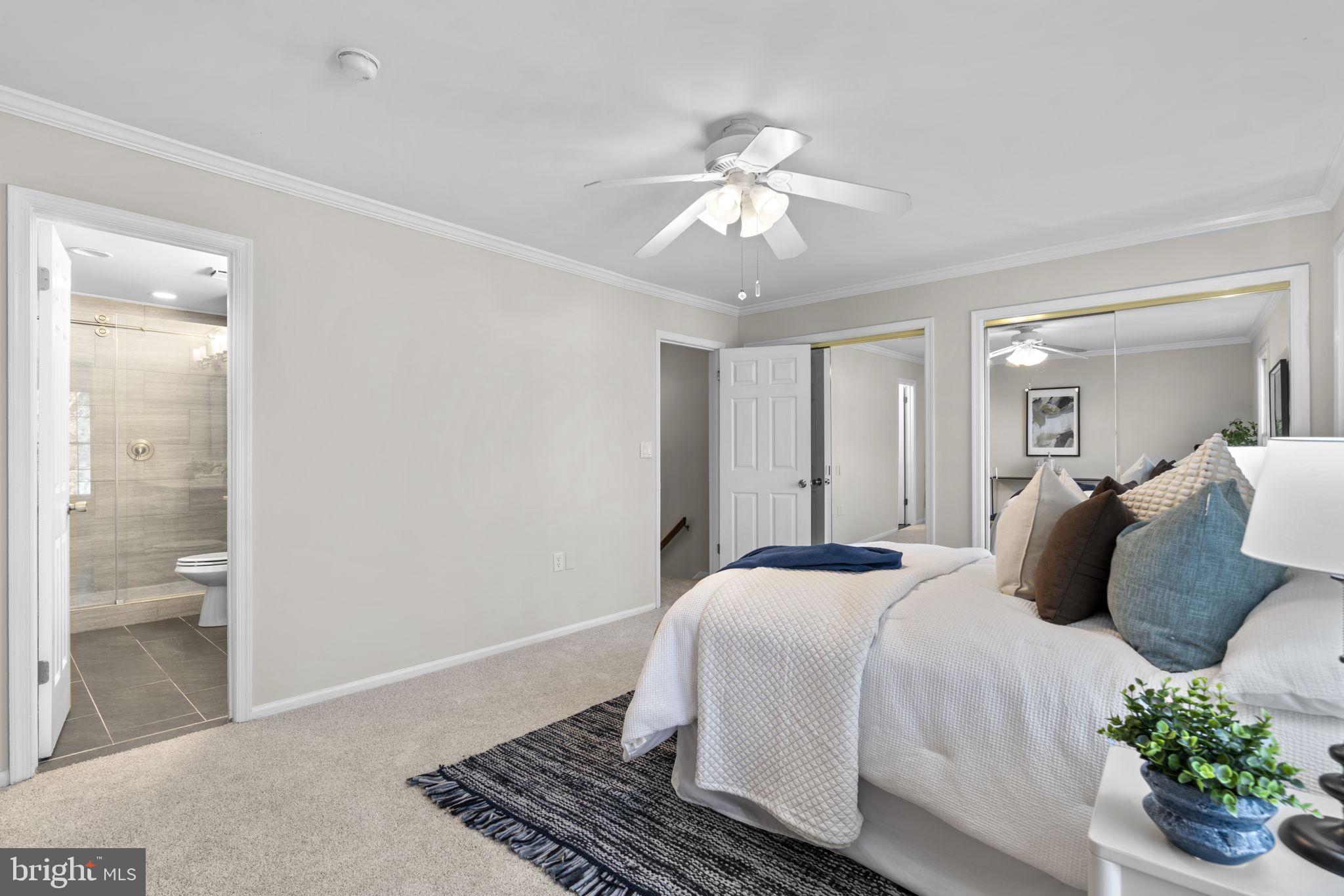 7525 Swan Point Way, Unit 195 Columbia, MD 21045 - Photo 16 of 30 a bedroom with a large bed and chandelier