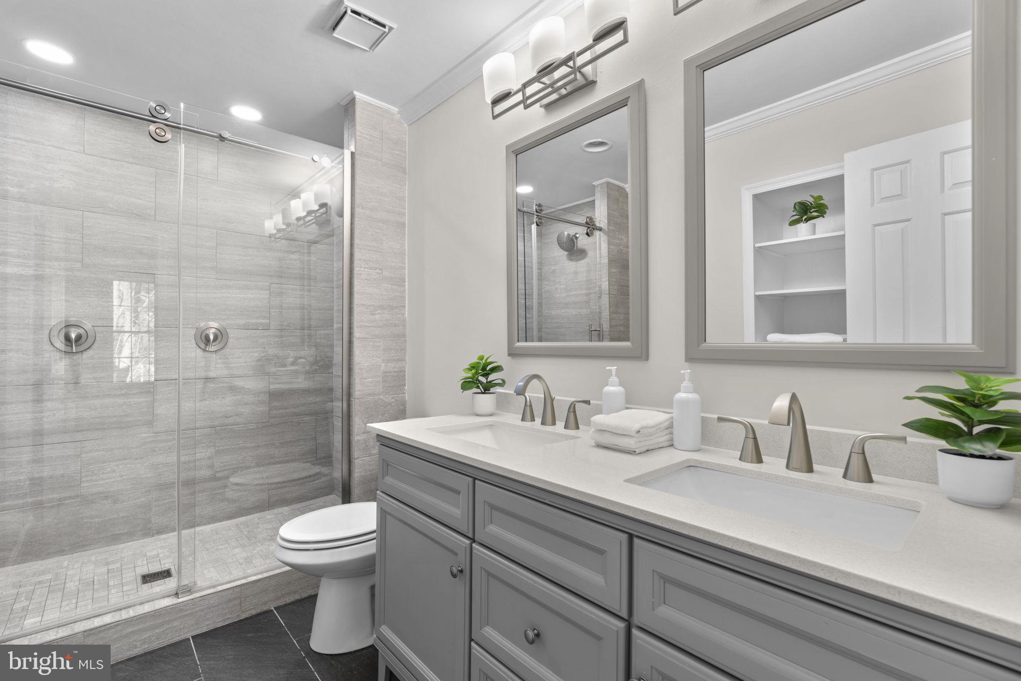 7525 Swan Point Way, Unit 195 Columbia, MD 21045 - Photo 17 of 30 a bathroom with a sink a toilet and shower
