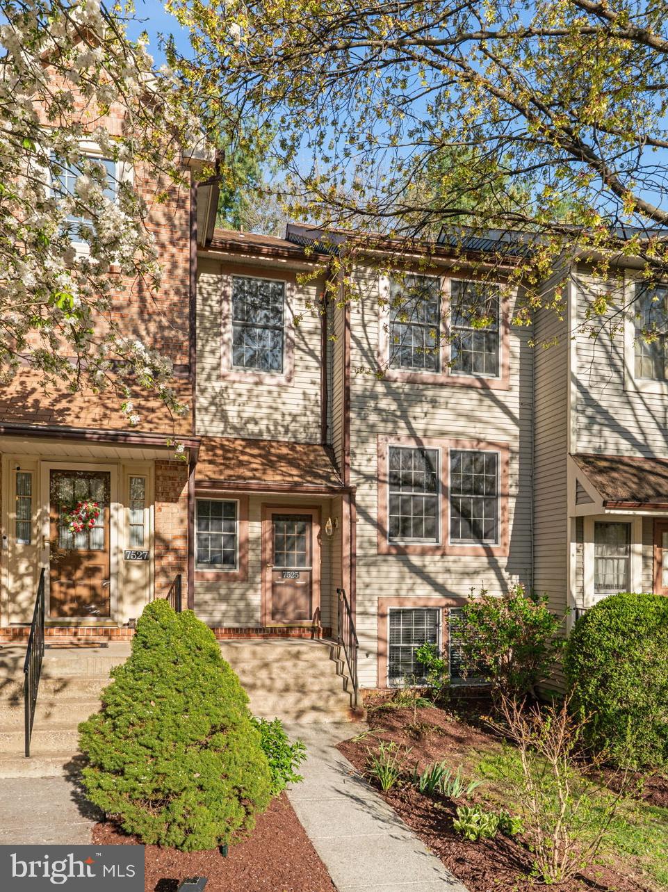 7525 Swan Point Way, Unit 195 Columbia, MD 21045 - Photo 2 of 30 front view of a house with a garden