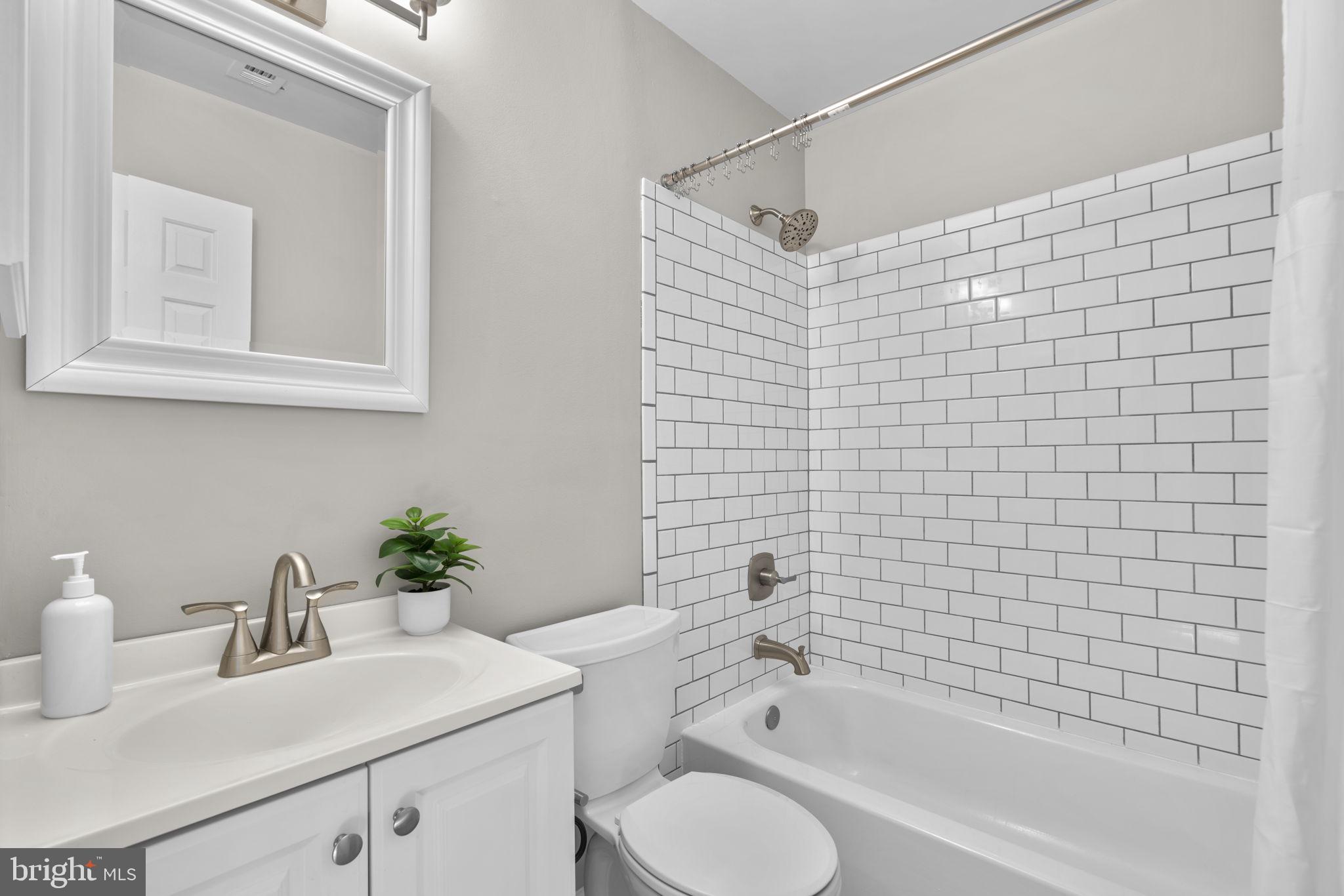 7525 Swan Point Way, Unit 195 Columbia, MD 21045 - Photo 26 of 30 a bathroom with a sink toilet and shower
