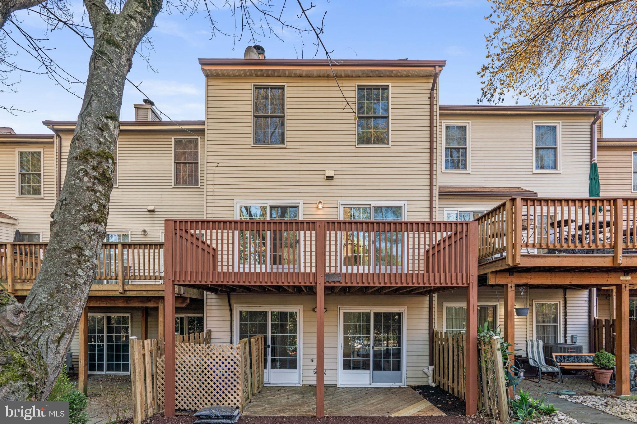 7525 Swan Point Way, Unit 195 Columbia, MD 21045 - Photo 29 of 30 a view of a brick house with large windows