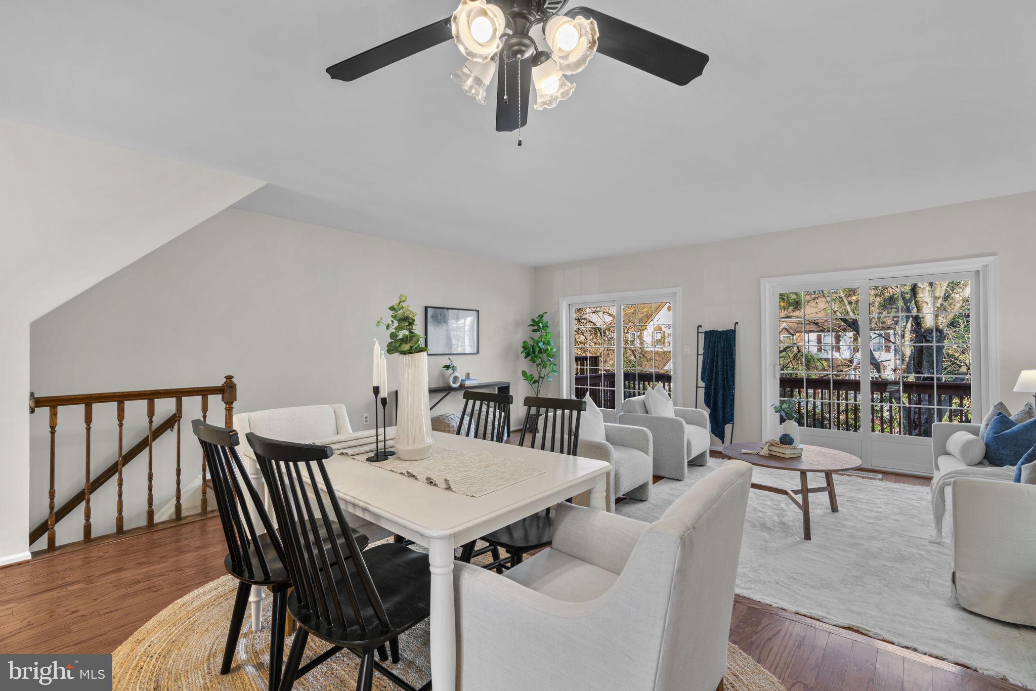 7525 Swan Point Way, Unit 195 Columbia, MD 21045 - Photo 9 of 30 a view of a dining room with furniture wooden floor and chandelier