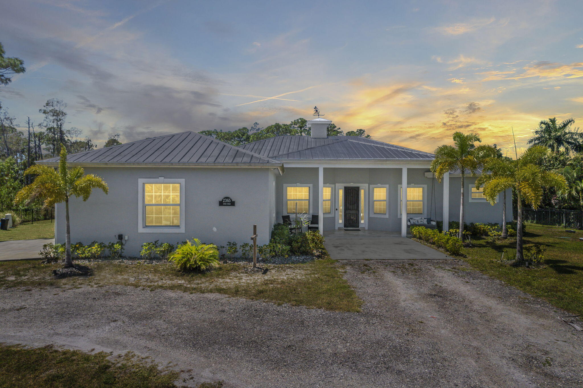 2365 Dyer Road Port St. Lucie, FL 34952 - Photo 3 of 44 Front facing twilight