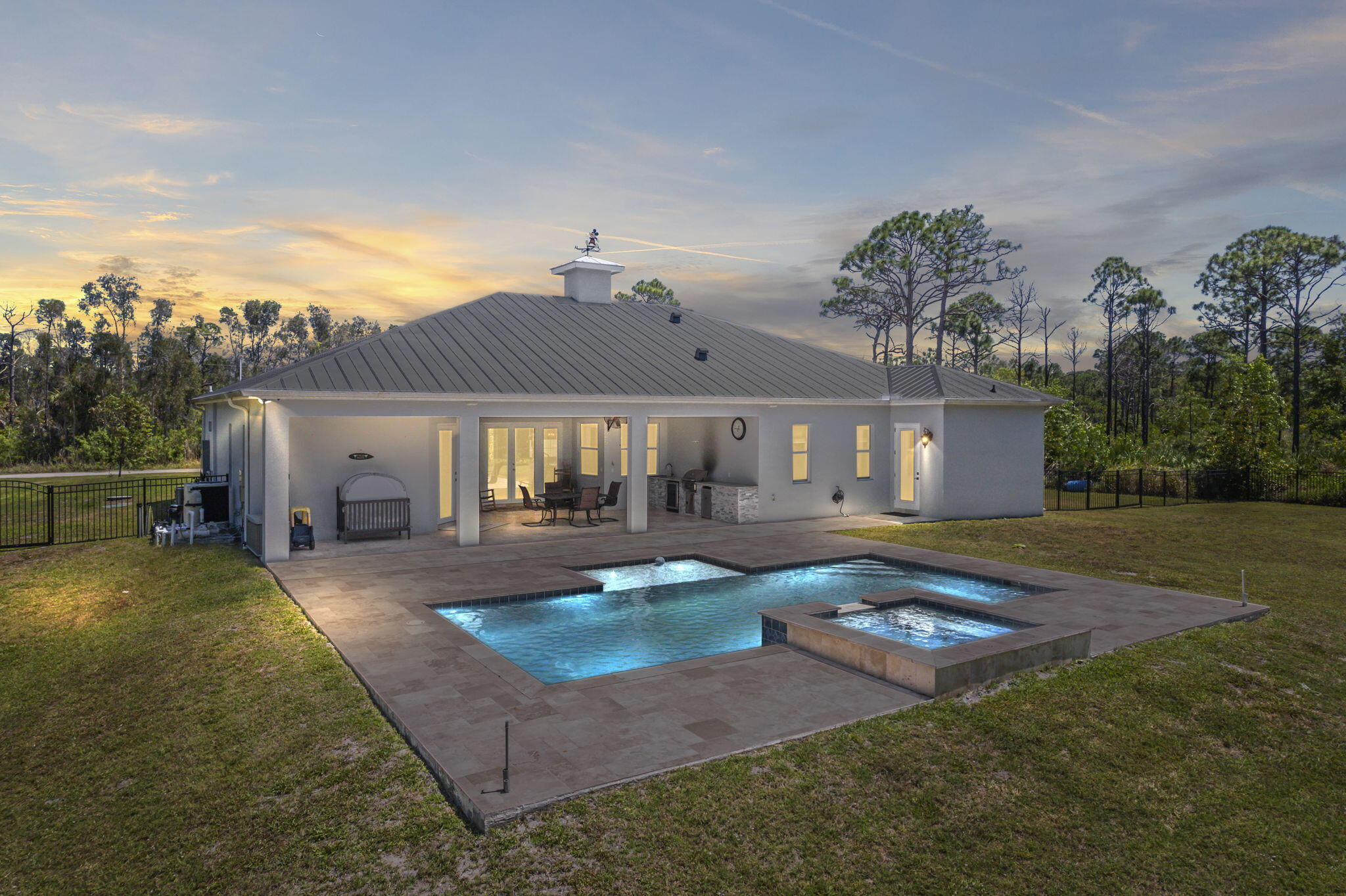 2365 Dyer Road Port St. Lucie, FL 34952 - Photo 5 of 44 Pool and Spa area Twilight