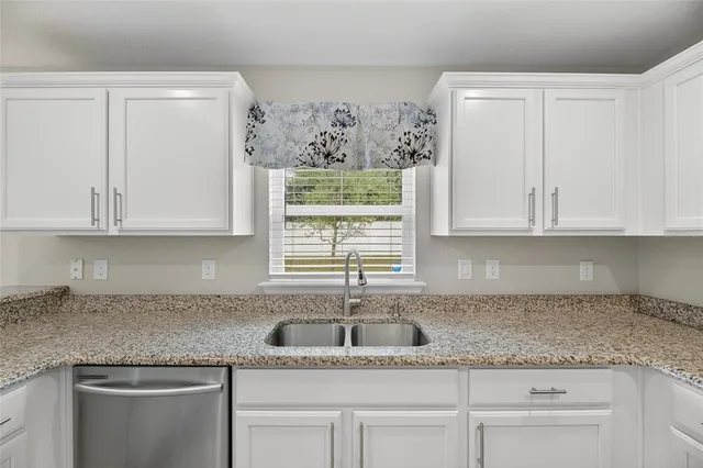 a white wall with a toilet