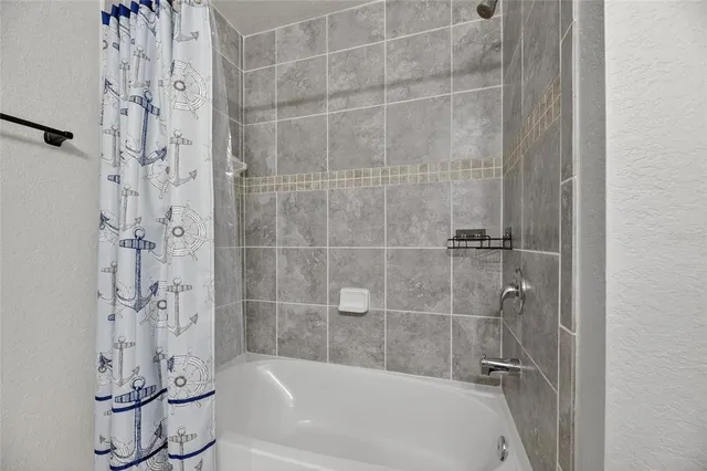 a view of hall way with furniture