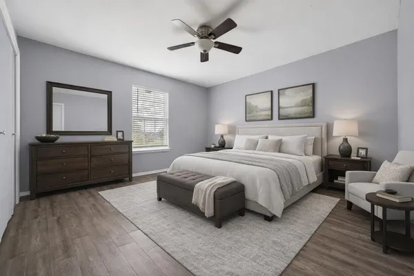 a bedroom with a bed and window