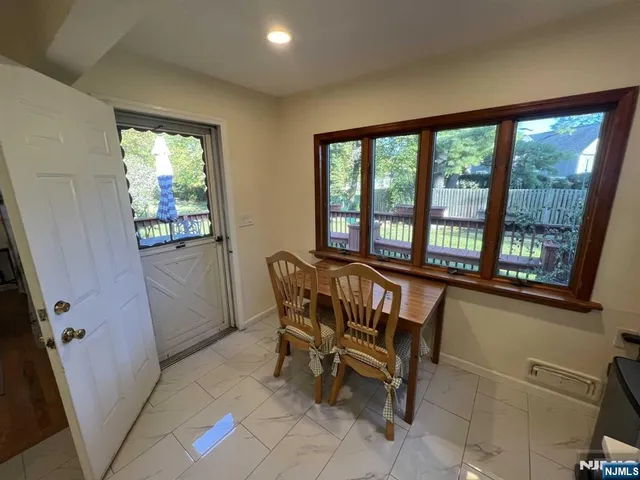 a view of a room with furniture and windows